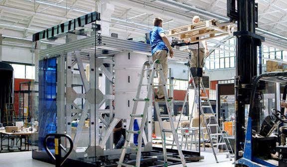 Men creating the physical space for Quantum computing to happen.