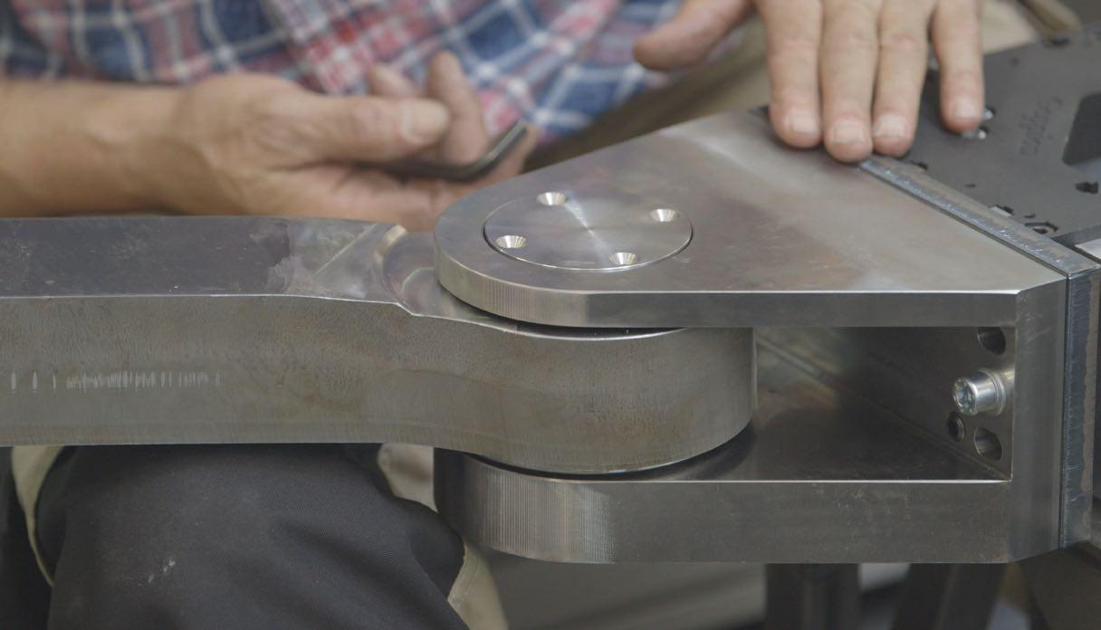 Zoomed in shot of a man’s hands putting together some hardware for Quantum computing.